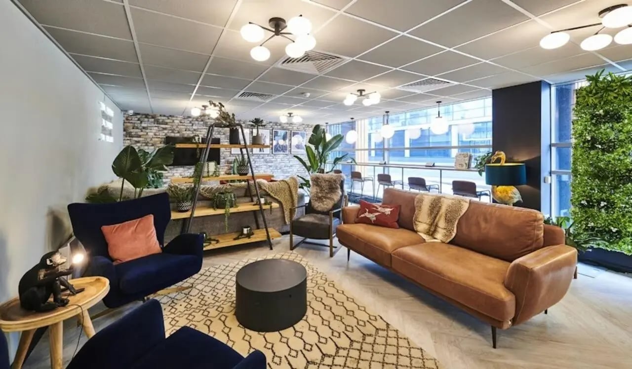 Sofas chairs coffee table and shelves living room at Capital Gate in Liverpool Student Accommodation
