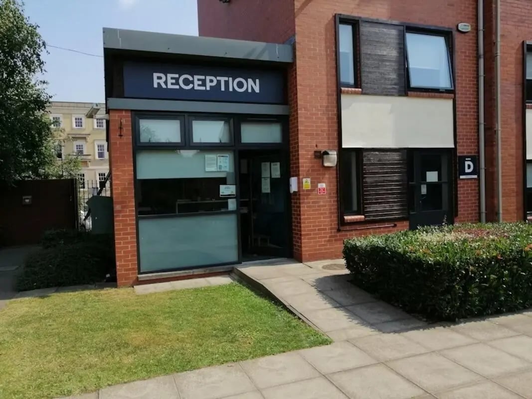 Reception building entrance with grass and paving exterior at Regents Court in Leicester Student Accommodation