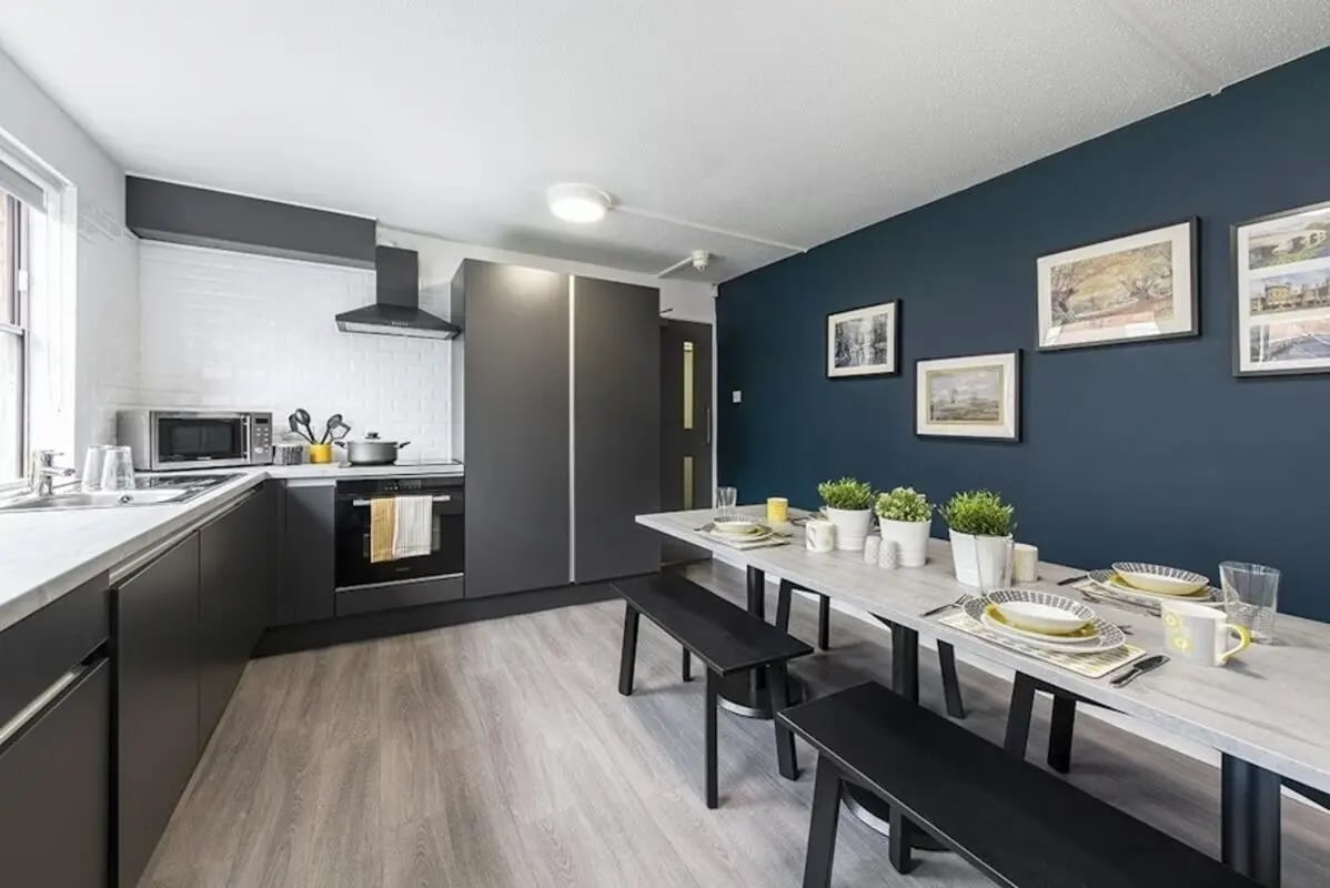 Modern kitchen with dining area and benches kitchen at Regents Court in Leicester Student Accommodation
