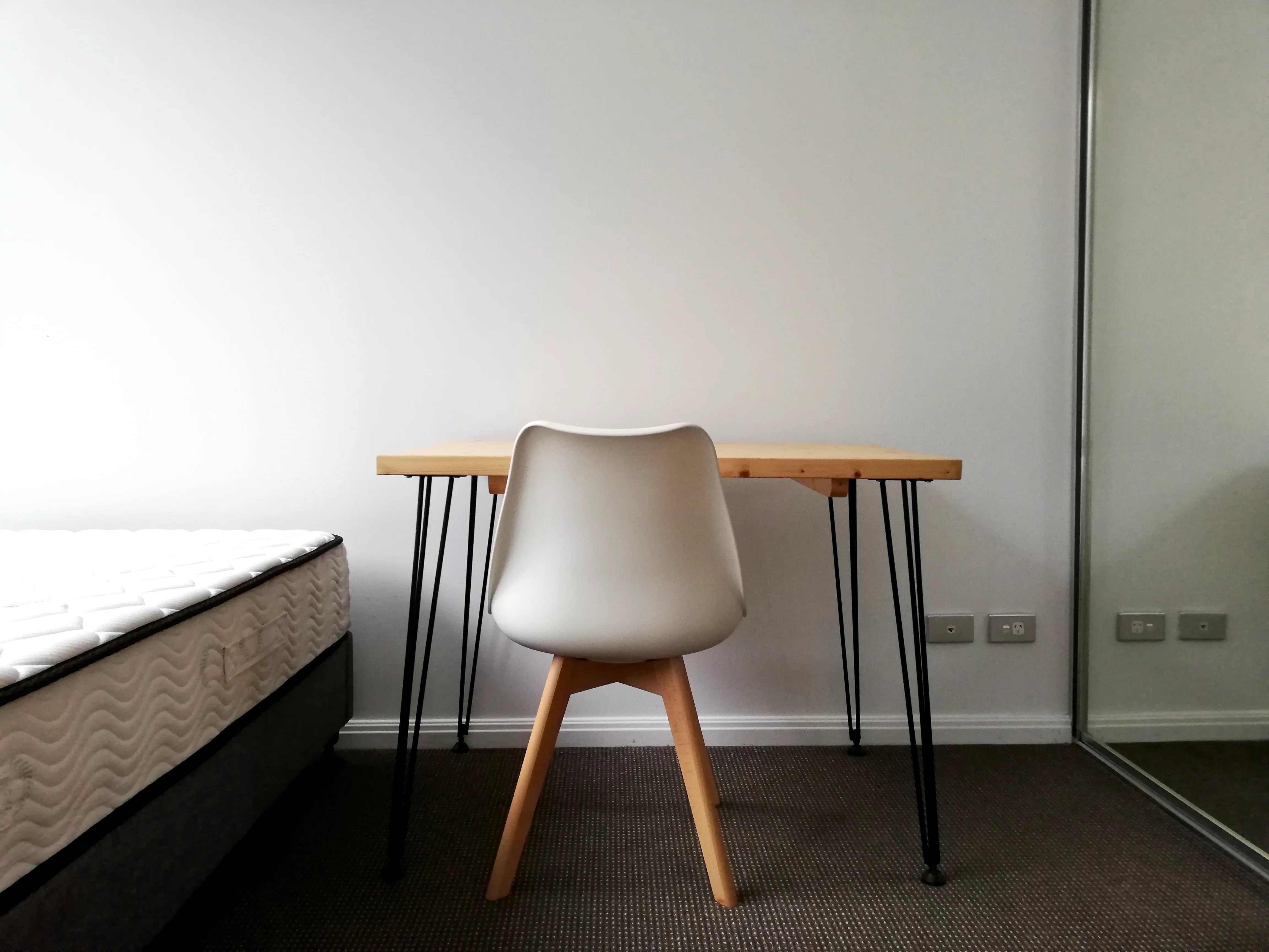 Mattress desk chair and mirror bedroom study area at Belong Waterloo in Sydney Student Accommodation
