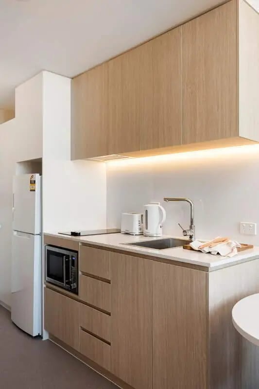 Kitchen with fridge microwave toaster kettle sink kitchen at Iglu Waterloo in Sydney Student Accommodation