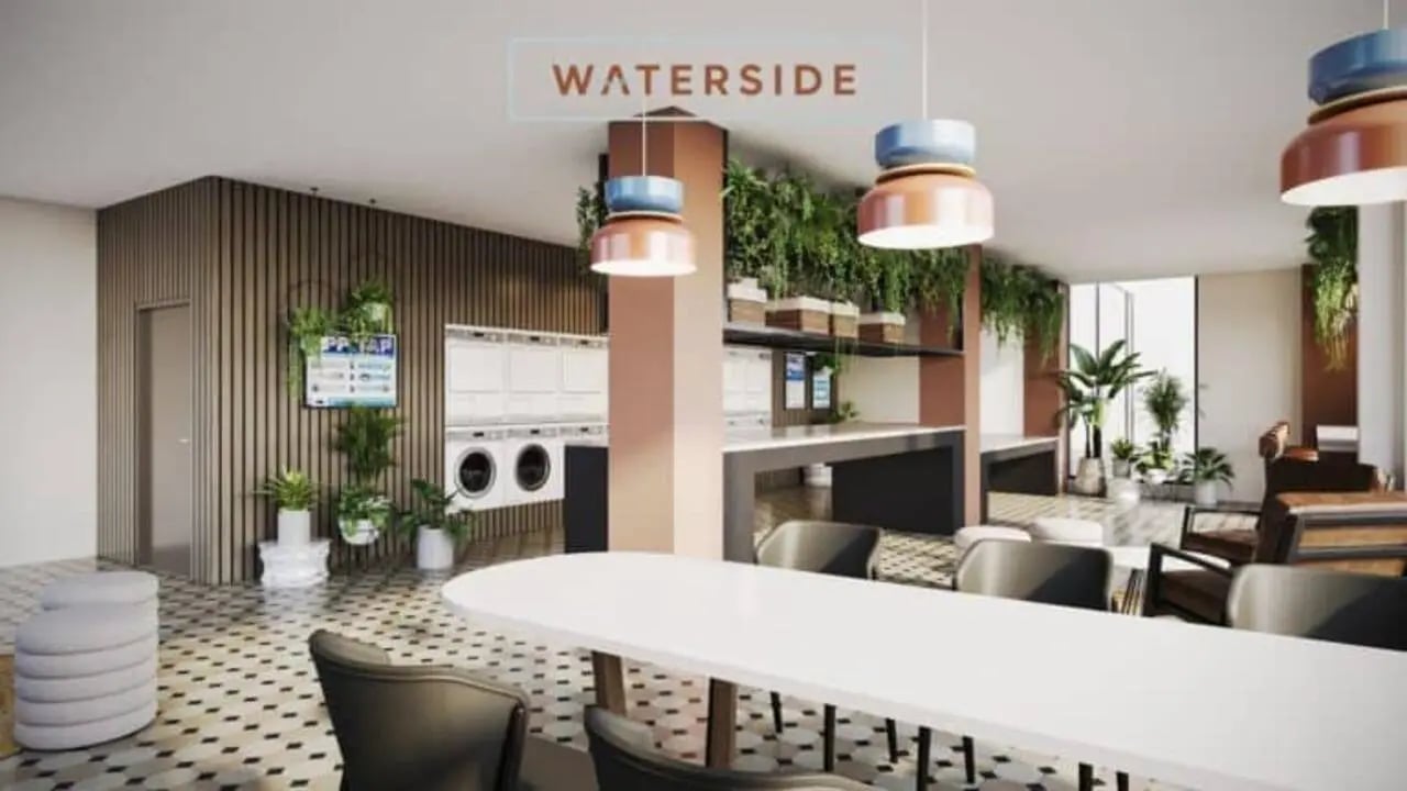 Laundry machines plants and seating common area at Waterside in Bristol Student Accommodation