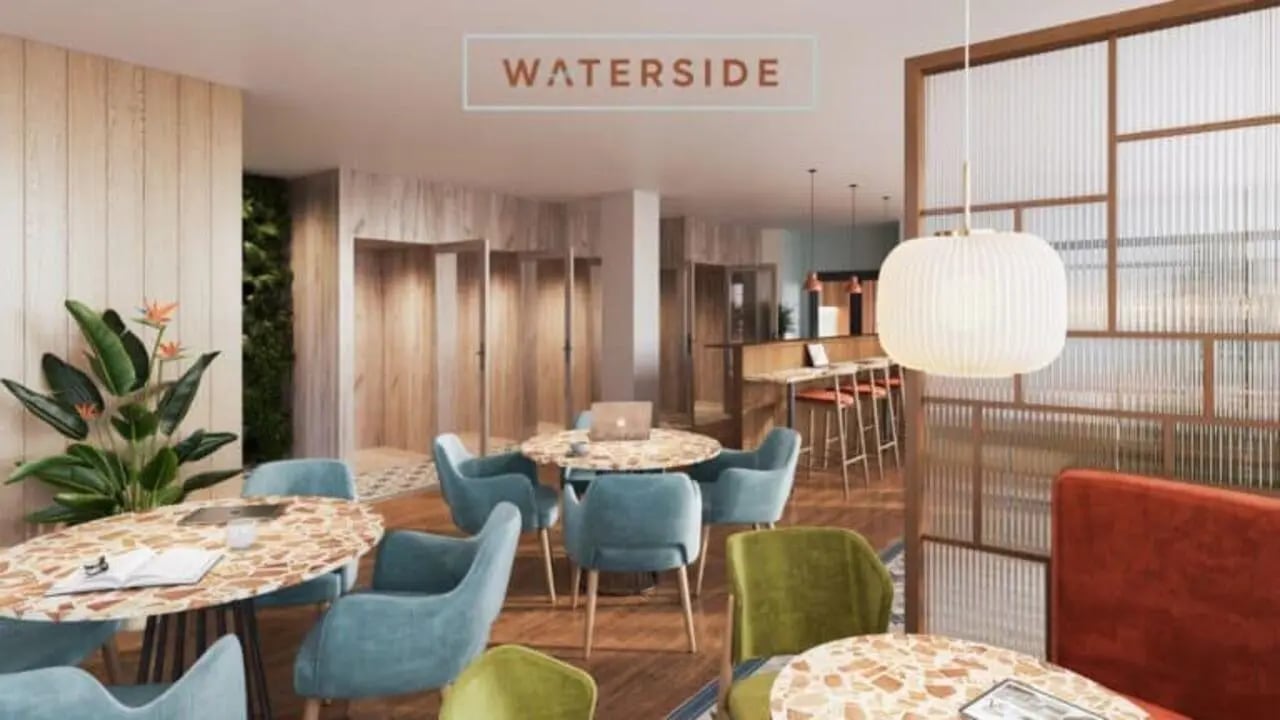 Modern communal area with lounge seating and tables living room at Waterside in Bristol Student Accommodation