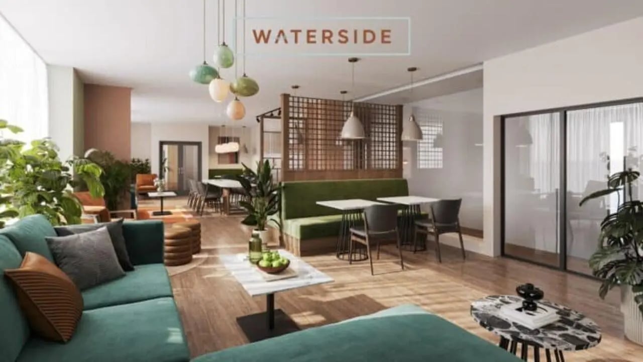Living room with green couch and dining area living room at Waterside in Bristol Student Accommodation
