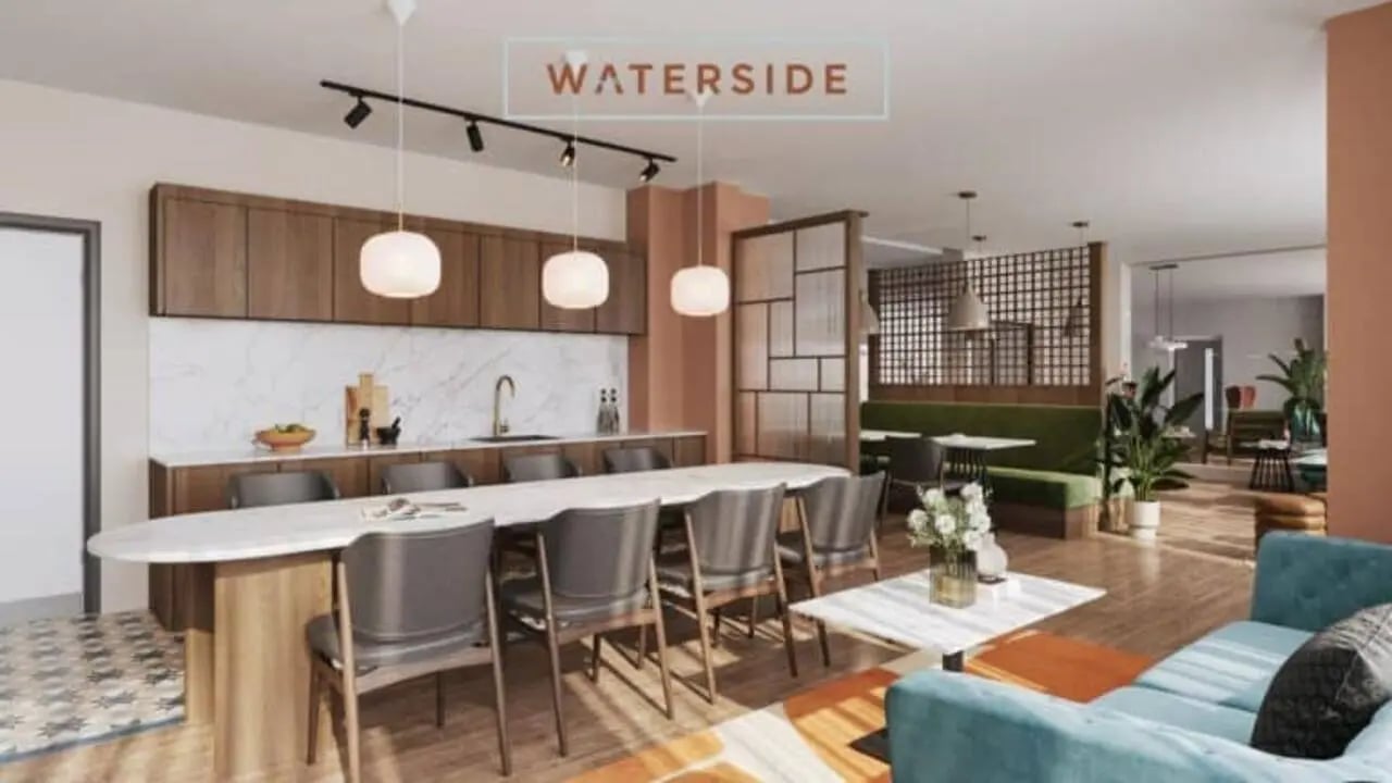 Kitchen dining area with communal table living room at Waterside in Bristol Student Accommodation