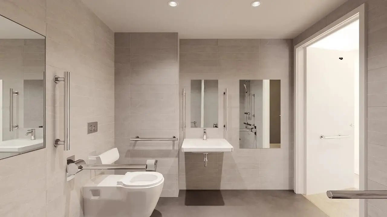 Toilet sink mirrors grab bars accessible bathroom at Signal House in London Student Accommodation
