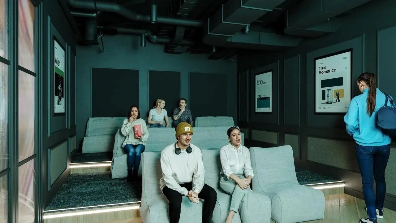 People watching movie in tiered seating cinema room at Signal House in London Student Accommodation