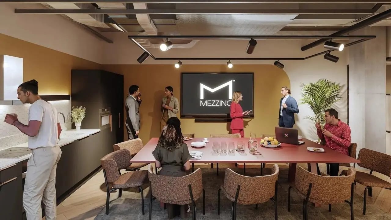 People at kitchen and meeting table common room at Signal House in London Student Accommodation