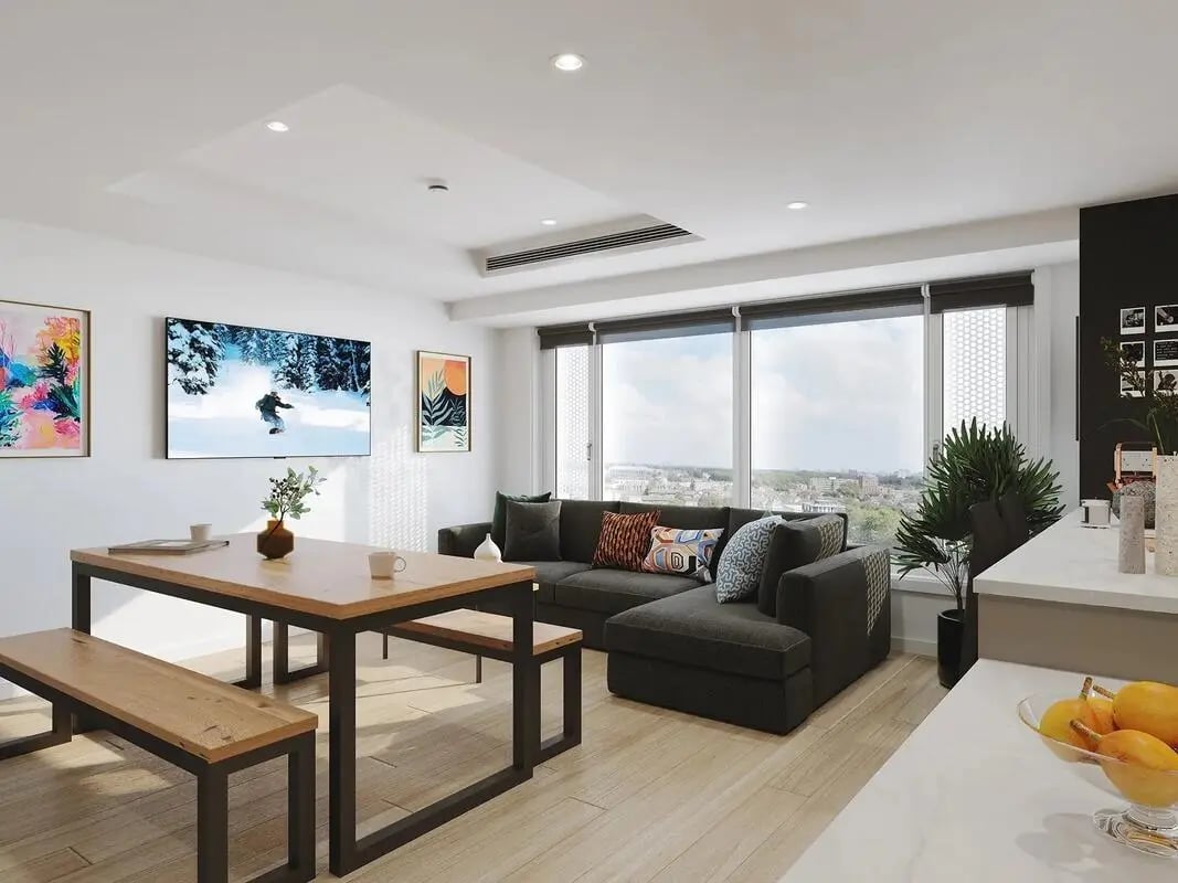 Dining table couch television and large window living room at Signal House in London Student Accommodation