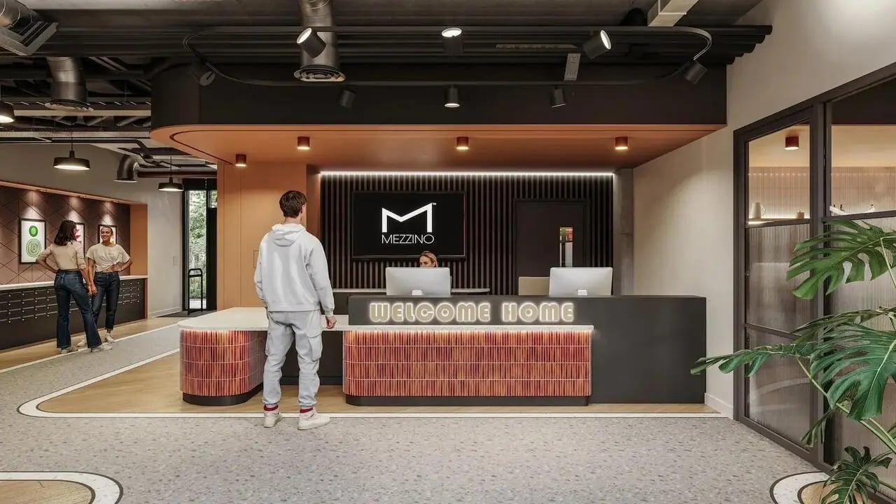 Reception desk with people and computers Lobby at Signal House in London Student Accommodation