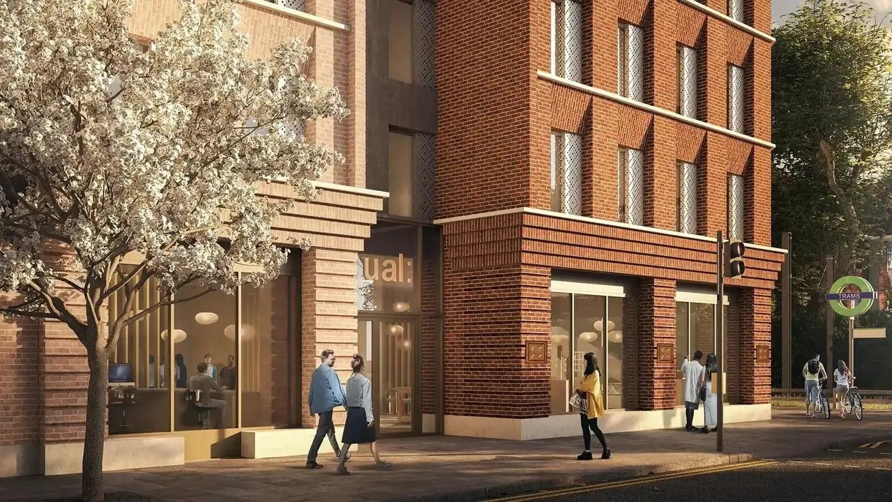 Brick building entrance with people and tree exterior at Signal House in London Student Accommodation