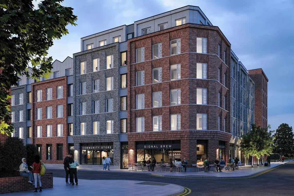 Modern brick building with cafe and community store exterior at Signal House in London Student Accommodation