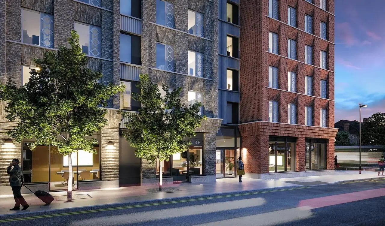 Modern brick building with trees and street exterior at Signal House in London Student Accommodation