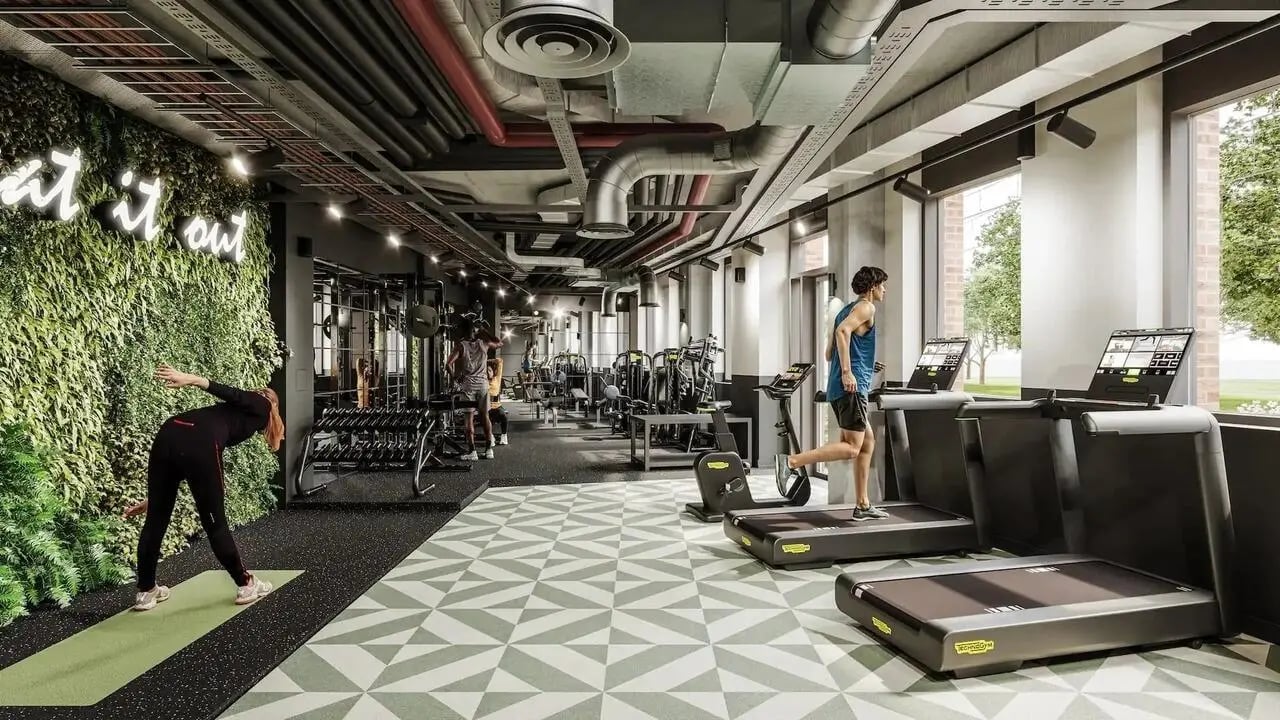 Treadmills people exercising dumbbells green wall Gym at Signal House in London Student Accommodation
