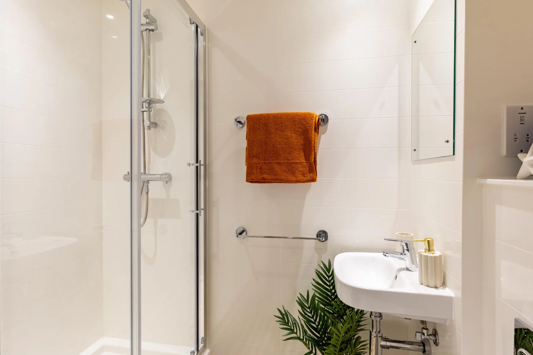Shower sink towel rack mirror bathroom at The Port On The Square in Bristol Student Accommodation