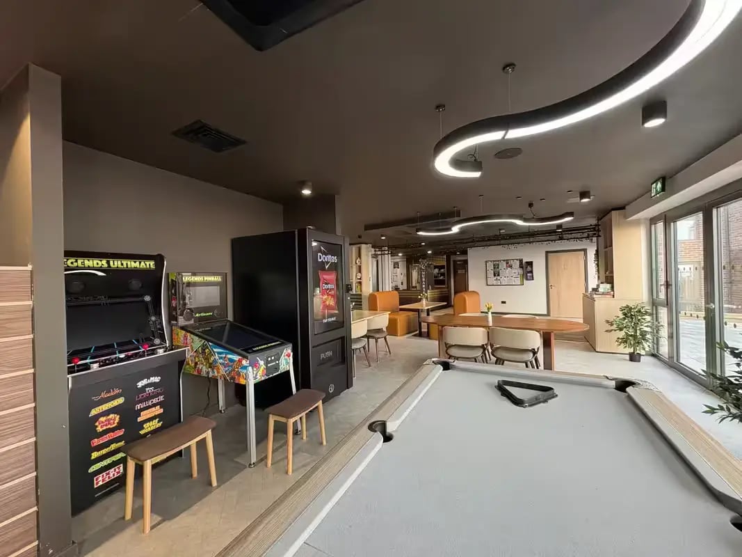 Arcade games pinball and pool table living room at The Port On The Square in Bristol Student Accommodation