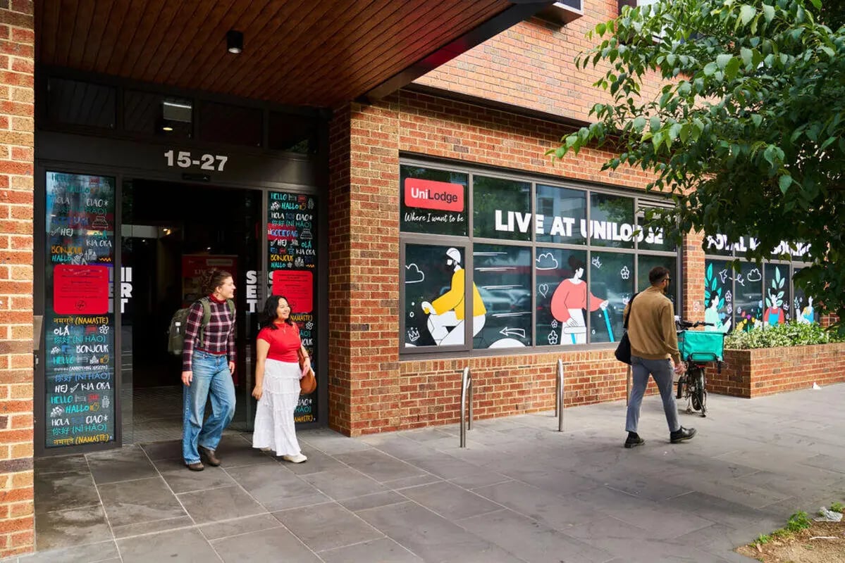 Entrance with students and signage exterior at UniLodge Royal Melbourne in Melbourne Student Accommodation