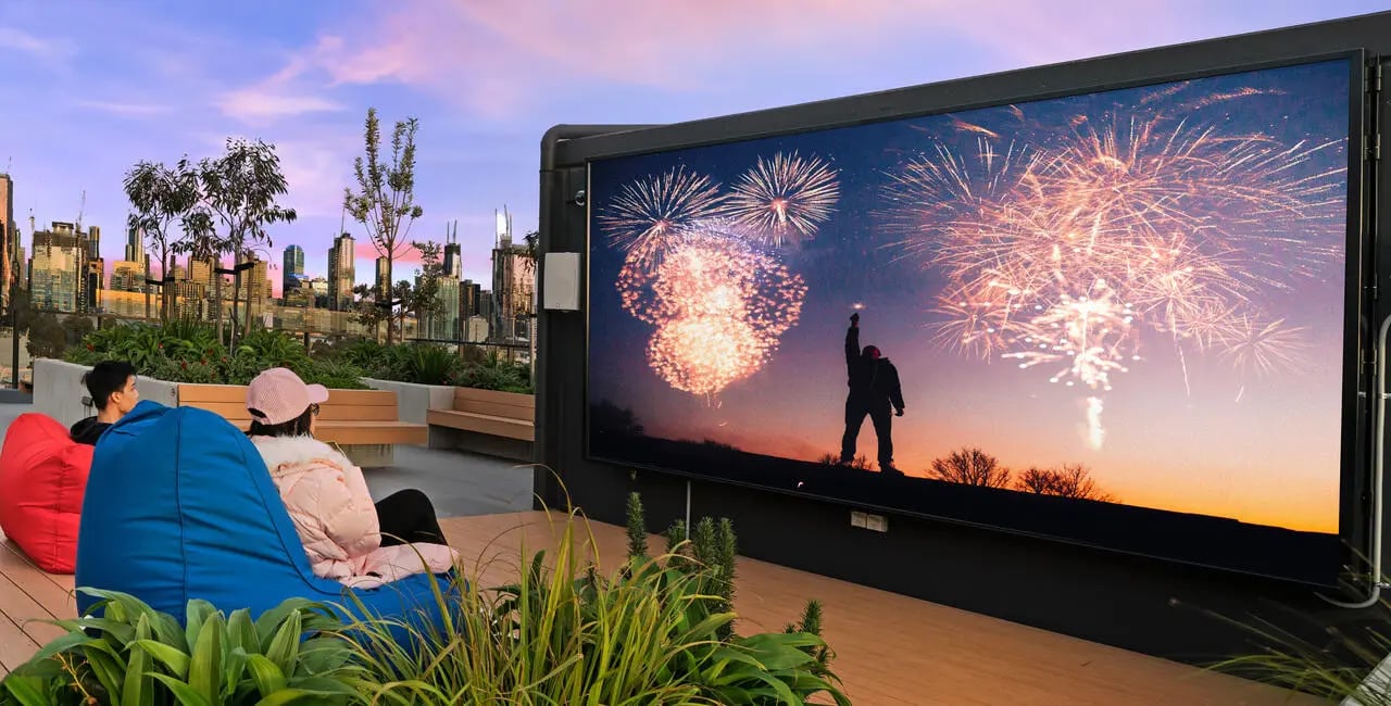 People watching fireworks on beanbags outdoor recreation area at UniLodge Royal Melbourne in Melbourne Student Accommodation