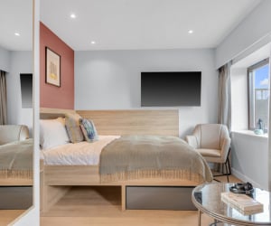Bed TV chair and mirror bedroom at Iconinc The Bonnie in Glasgow Student Accommodation