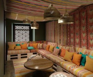 Comfortable lounge seating with patterned cushions living room at Iconinc The Bonnie in Glasgow Student Accommodation