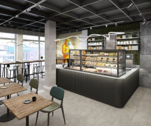 Cafe counter with pastries and seating area cafe at Iconinc The Bonnie in Glasgow Student Accommodation