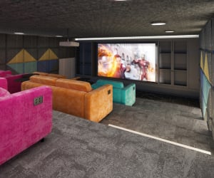 Colorful sofas facing projector screen cinema room at Iconinc The Bonnie in Glasgow Student Accommodation