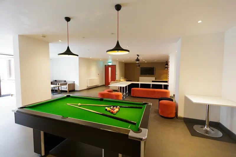 Pool table with balls and cues communal area at AXO New Cross in London Student Accommodation