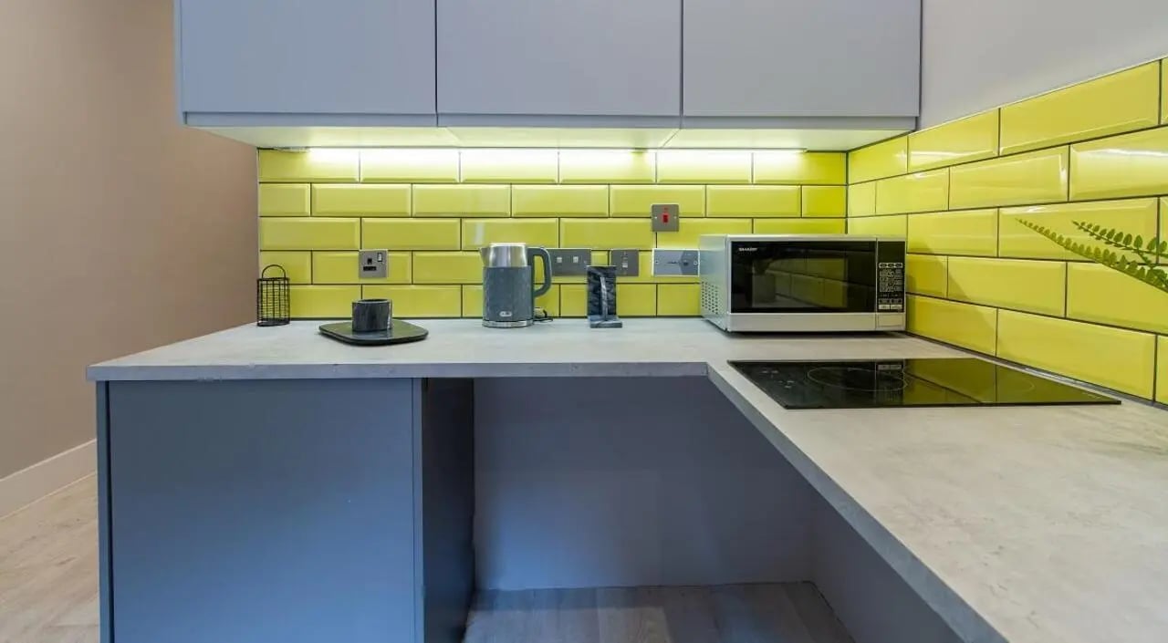 Modern kitchen counter with kettle microwave induction hob kitchen at AXO Seven Sisters in London Student Accommodation