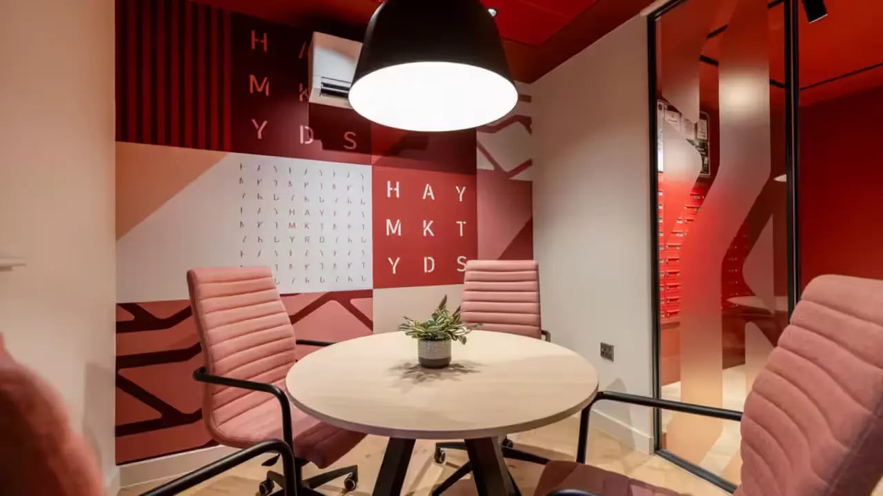 Round table pink chairs plant decor study area at Haymarket Yards in Edinburgh Student Accommodation