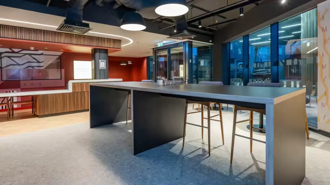 Long table with bar stools communal area at Haymarket Yards in Edinburgh Student Accommodation