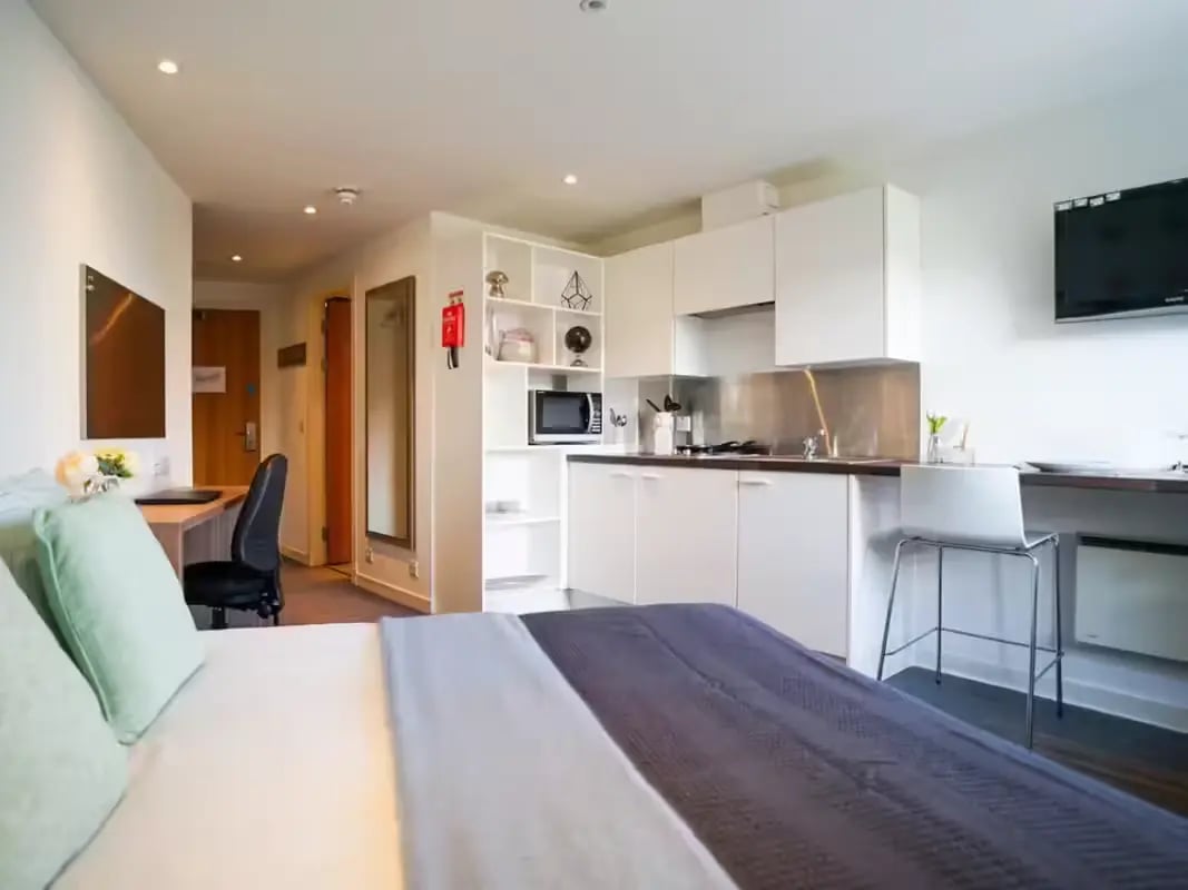 Kitchenette with desk and bed area studio at Gallery Apartments in Glasgow Student Accommodation