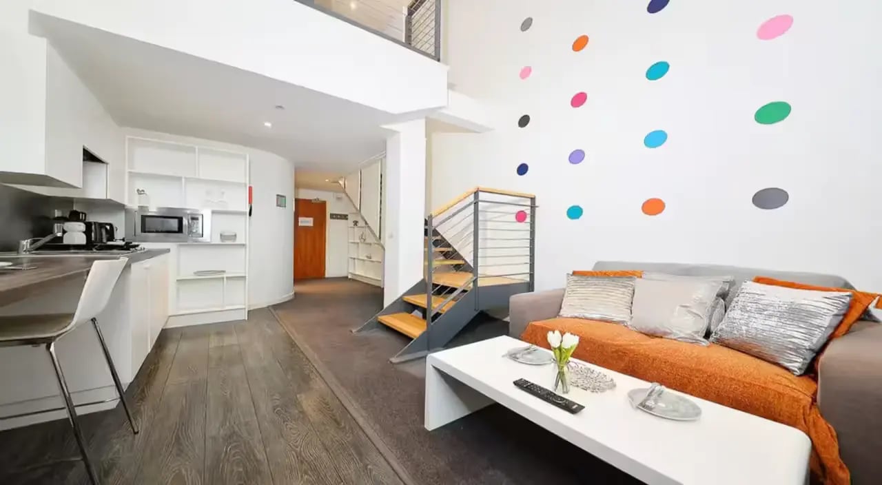 Kitchen living area with colorful dots staircase living area at Gallery Apartments in Glasgow Student Accommodation