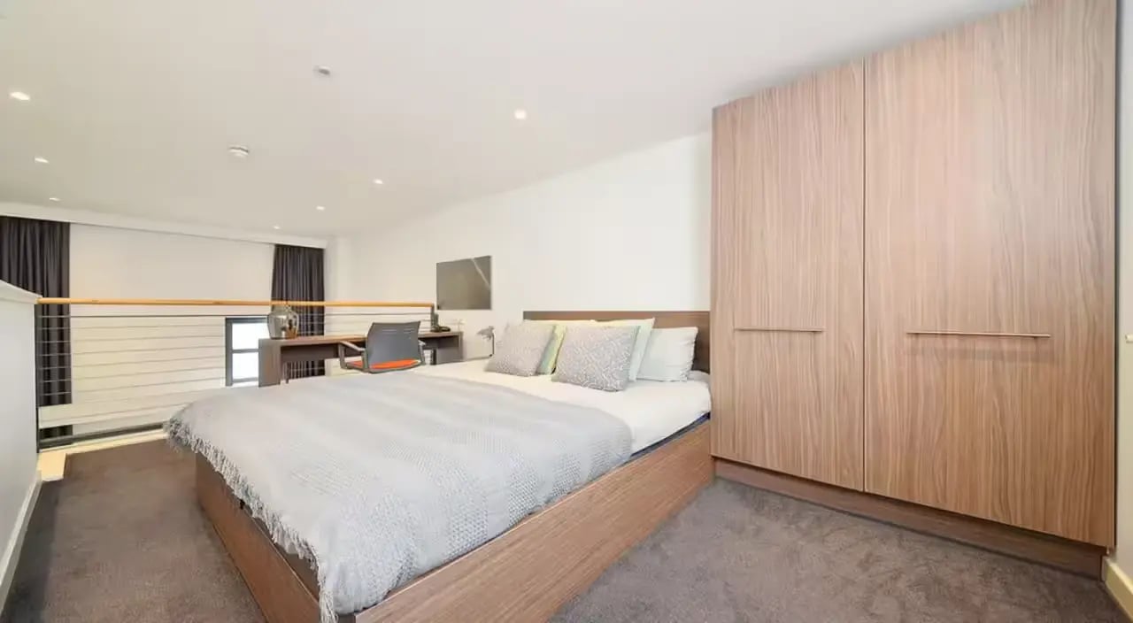 Bed desk wardrobe and railing bedroom at Gallery Apartments in Glasgow Student Accommodation