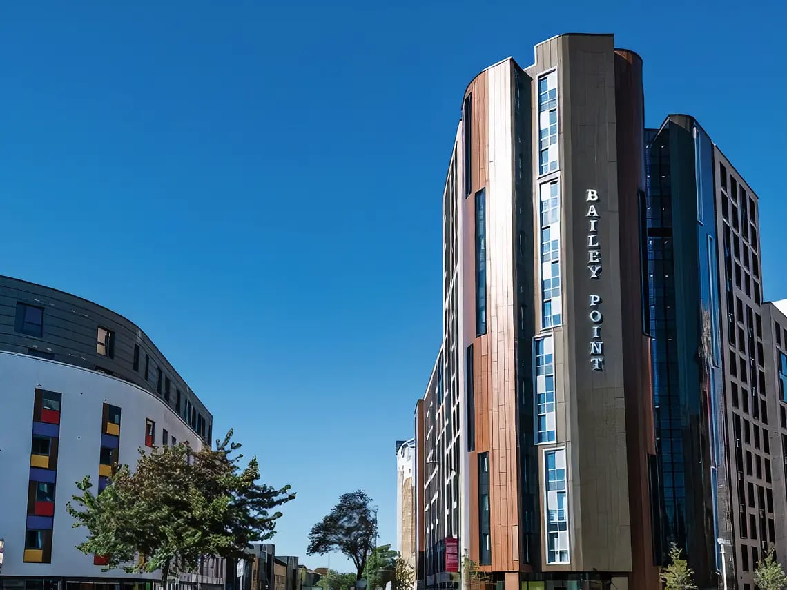 Modern student accommodation buildings under blue sky exterior at Yugo Bailey Point in Bournemouth Student Accommodation