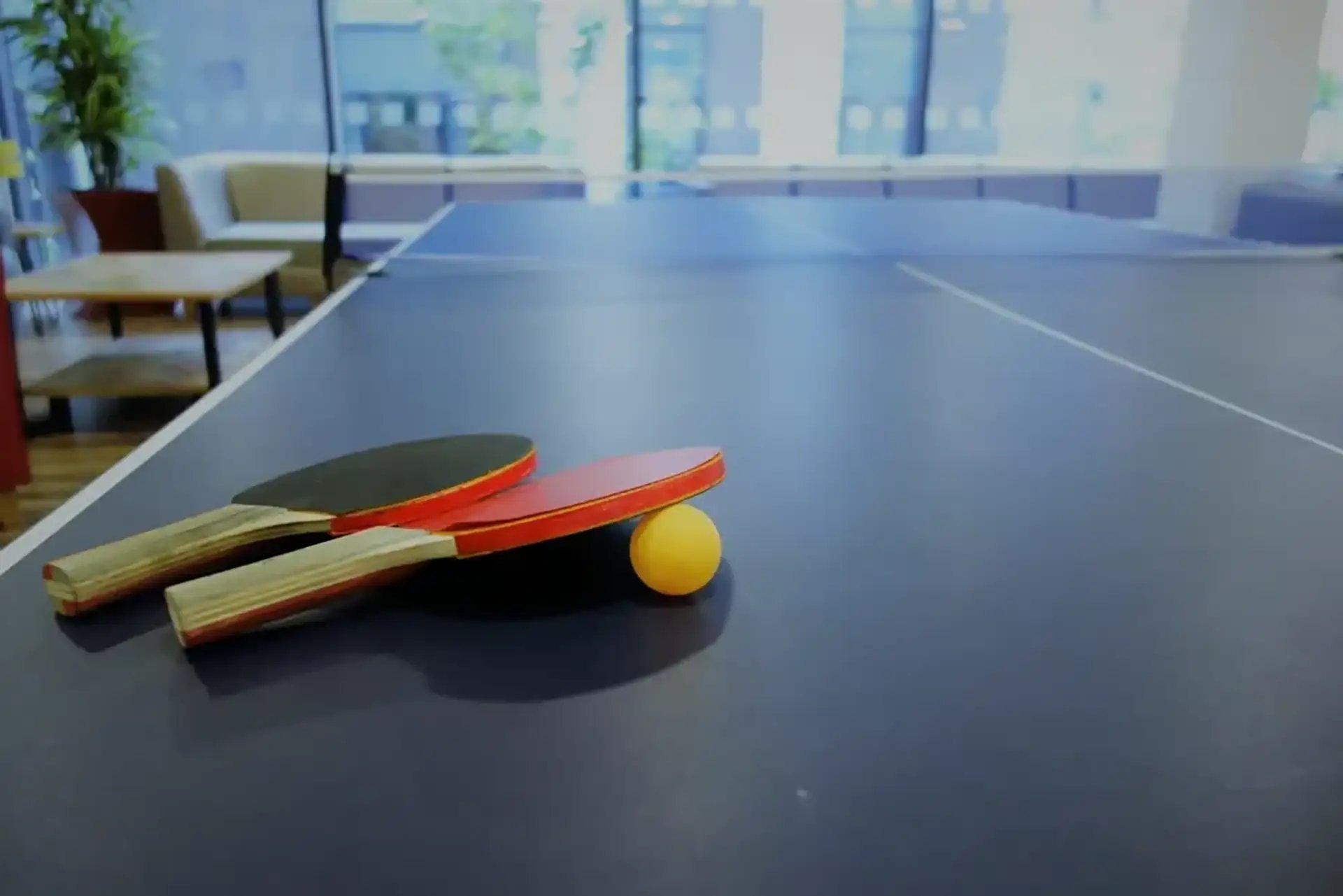Two ping pong paddles and ball playing area at Friargate Court in Preston Student Accommodation
