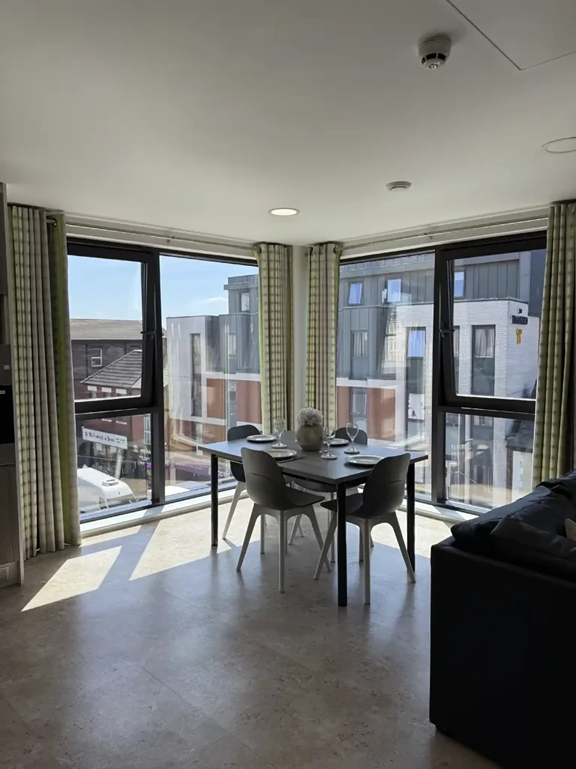 Dining table chairs and sofa living room at Friargate Court in Preston Student Accommodation
