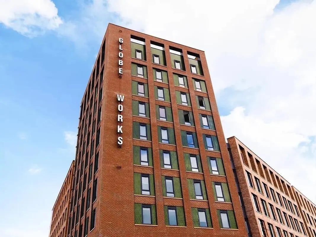 Brick building with Globe Works sign exterior at Globe Works in Birmingham Student Accommodation