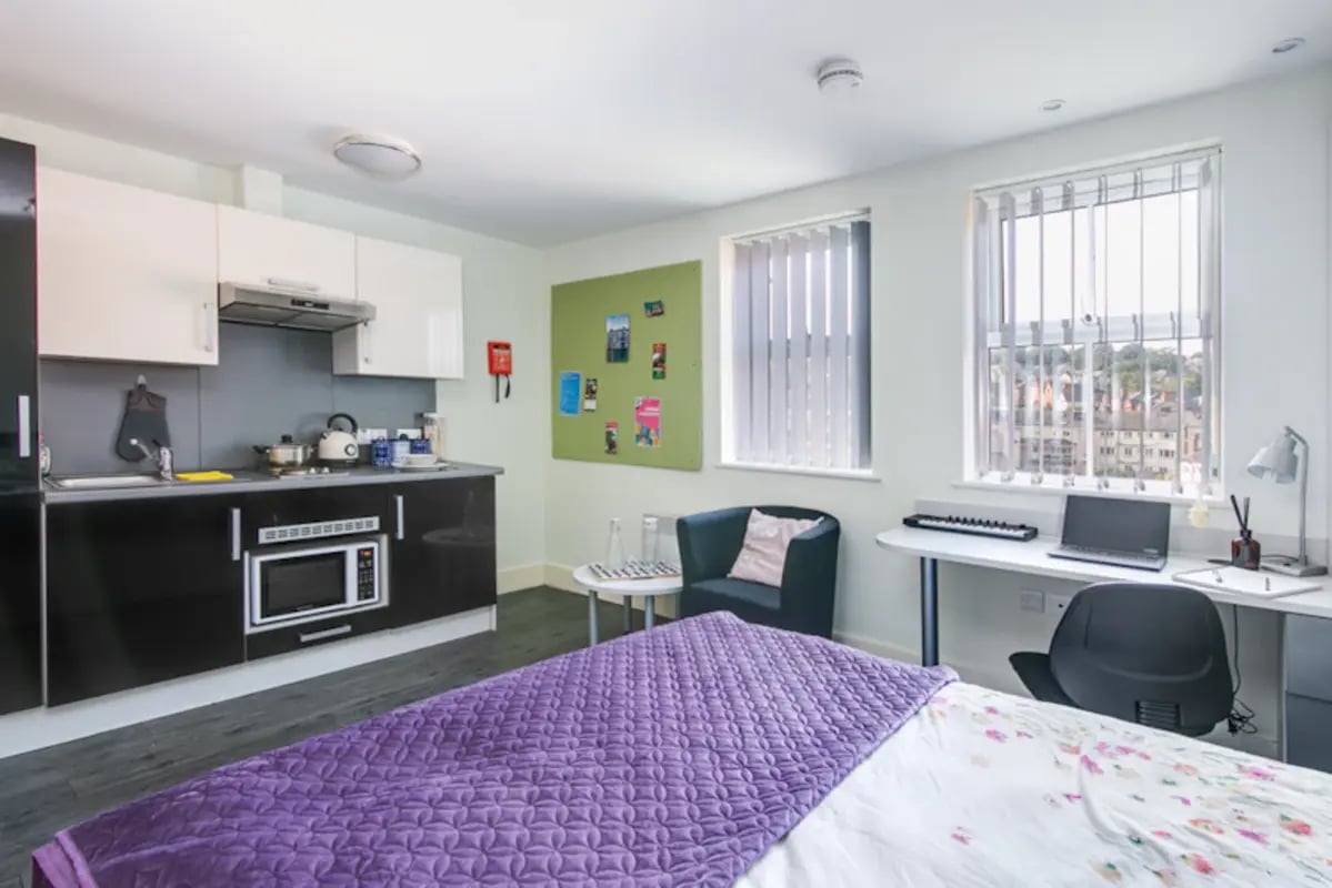 Kitchen desk chair and bed student studio at Ty Ni in Bangor Student Accommodation