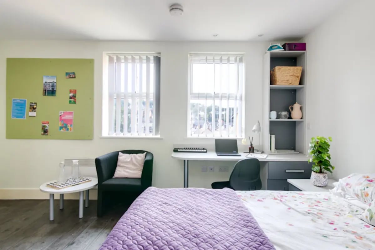 Bed desk chair bulletin board study bedroom at Ty Ni in Bangor Student Accommodation