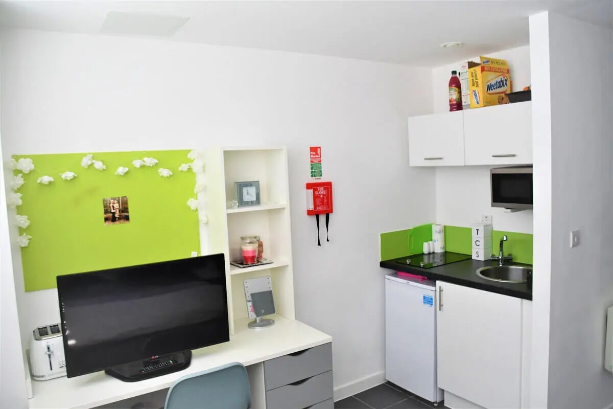 Desk with TV and toaster kitchen area at Tudor Studios in Leicester Student Accommodation