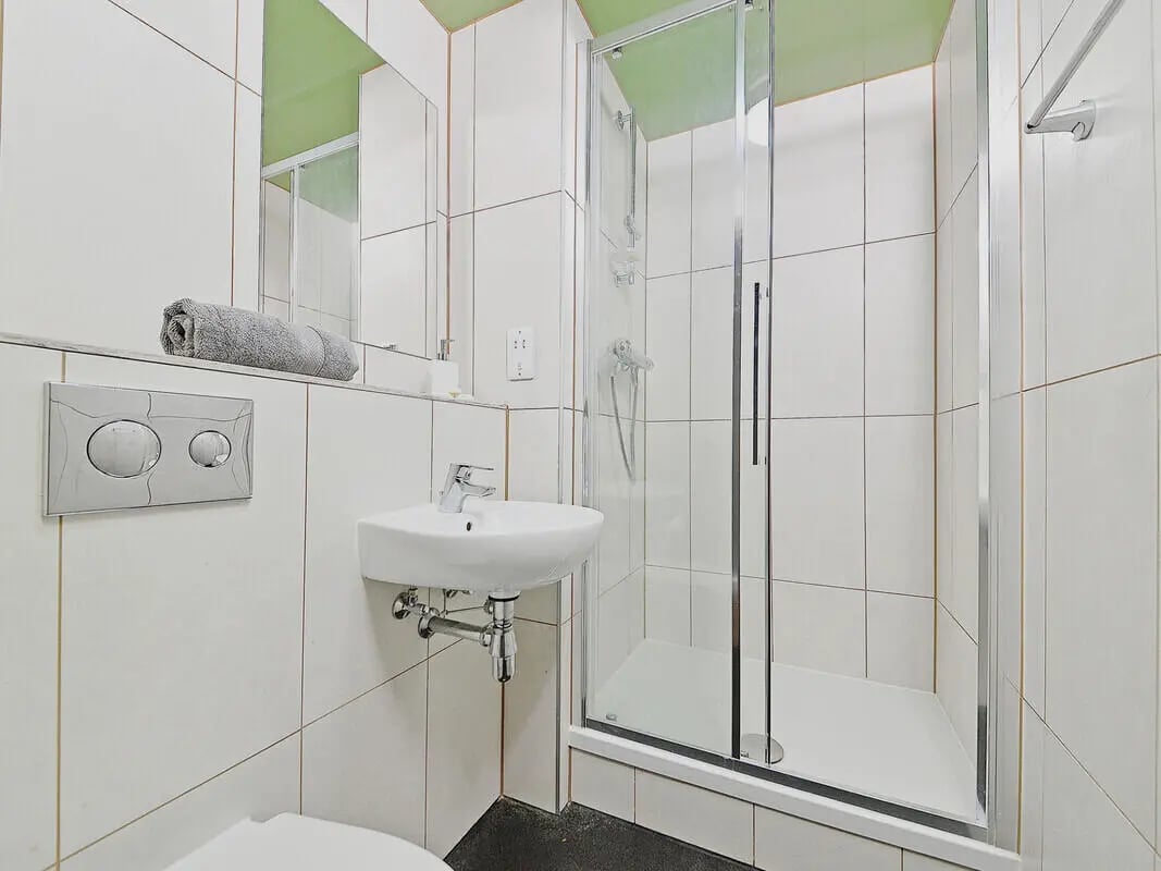 Sink toilet flush panel shower cubicle bathroom at Fontenoy Apartments in Liverpool Student Accommodation