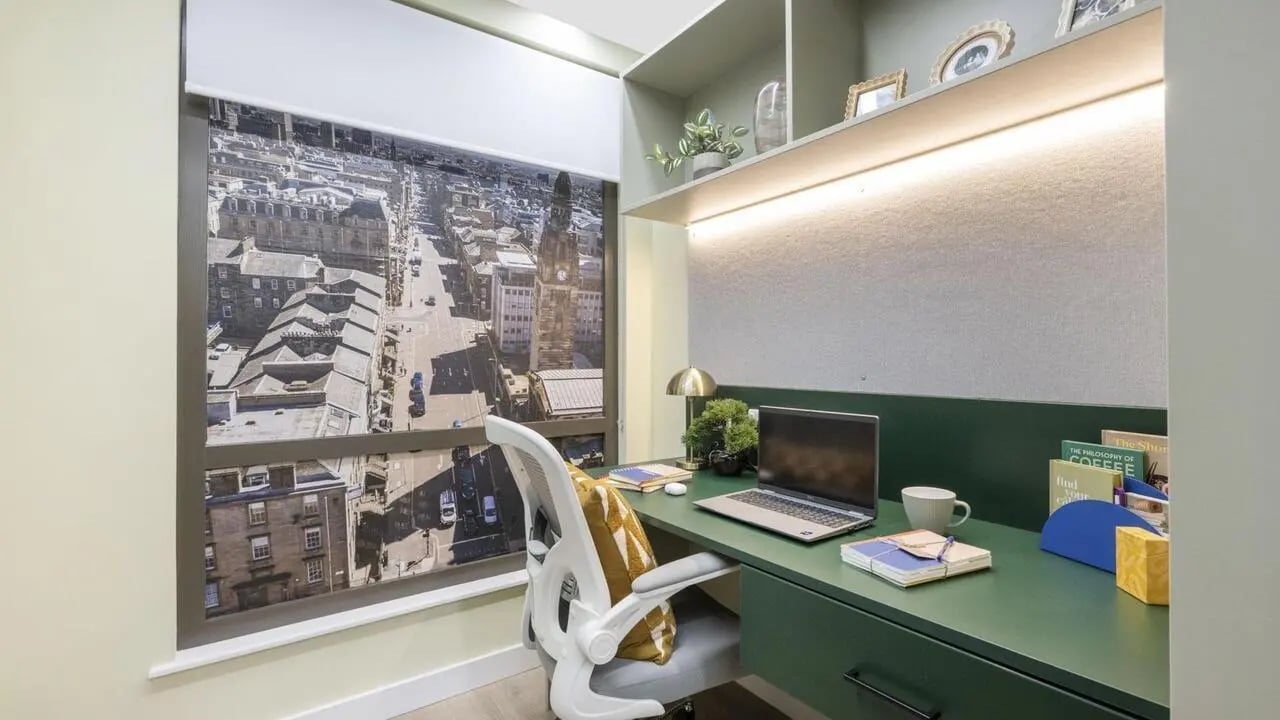 Desk with laptop chair and city view study area at St Vincent Studios in Glasgow Student Accommodation