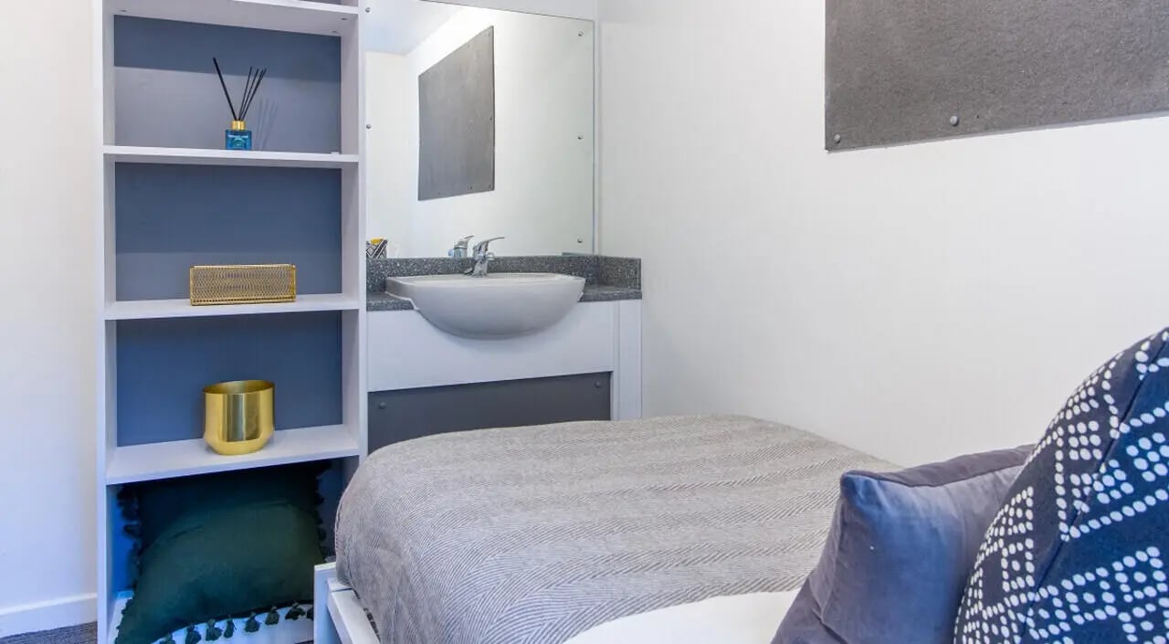 Bed sink shelves and decor bedroom at Green Wood Court in Southampton Student Accommodation