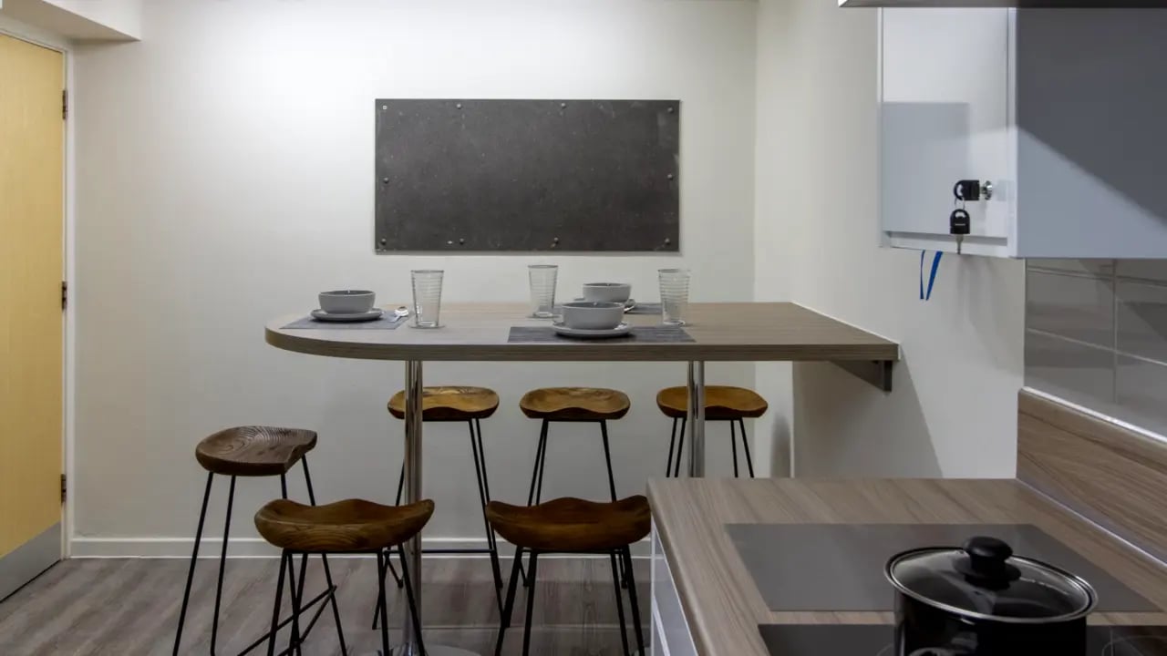 Kitchen table and stools with chalkboard kitchen at Green Wood Court in Southampton Student Accommodation