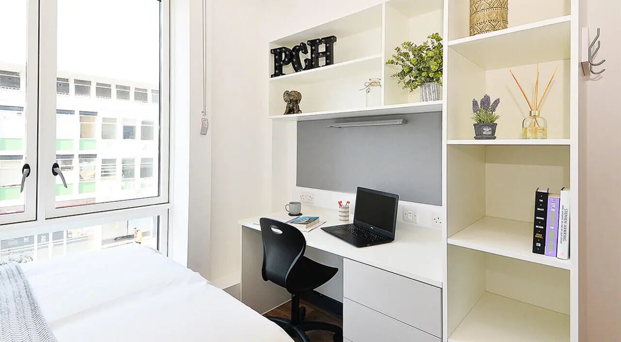 Desk with laptop and chair study area at Plymouth Cross House in Plymouth Student Accommodation