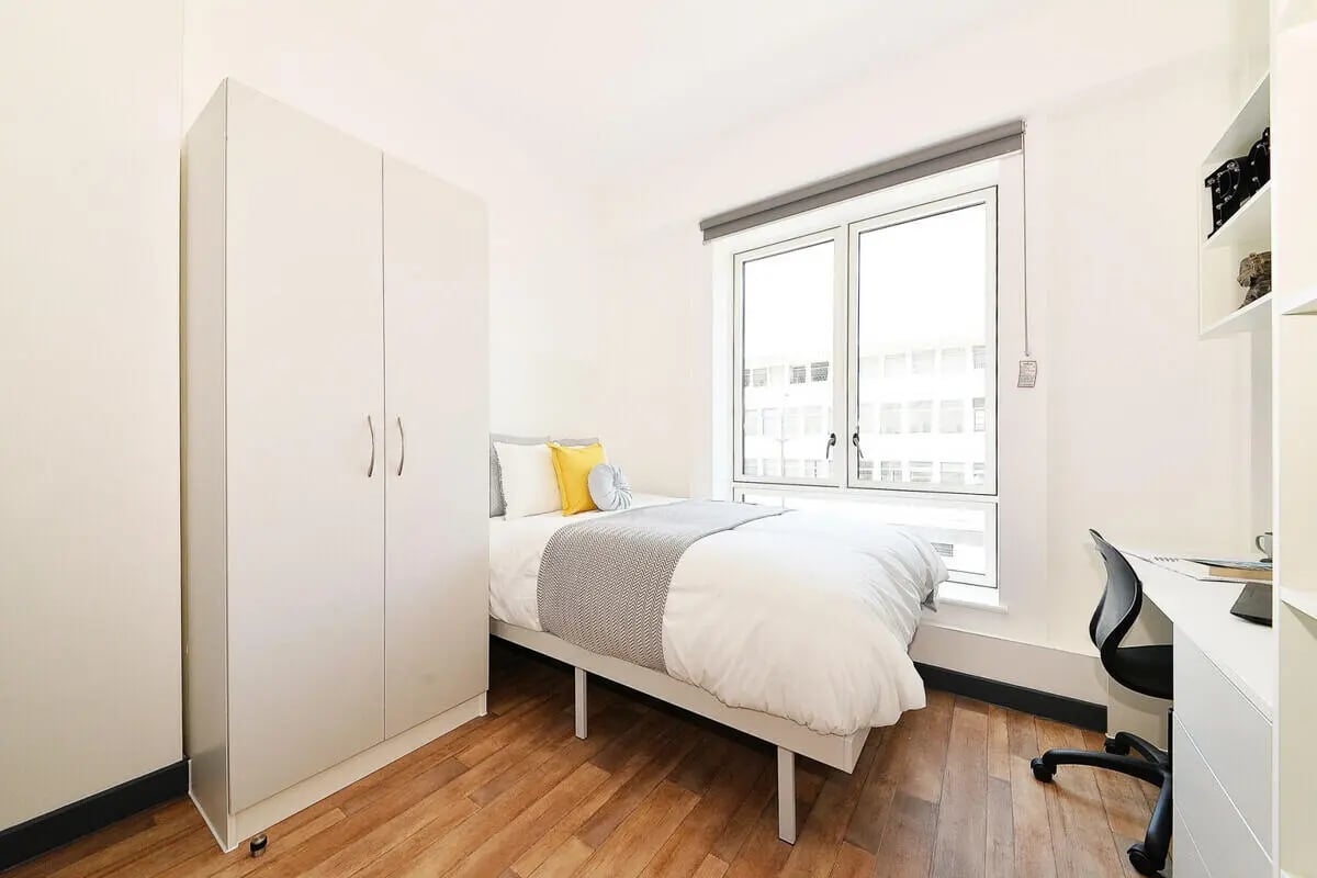 Wardrobe bed desk with chair and window bedroom at Plymouth Cross House in Plymouth Student Accommodation