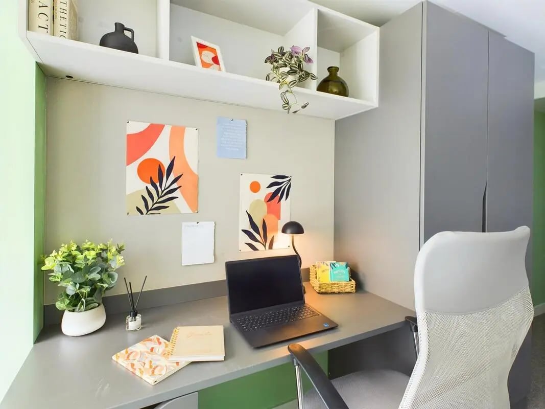 Desk with laptop art and chair study area at The Edge in Belfast Student Accommodation