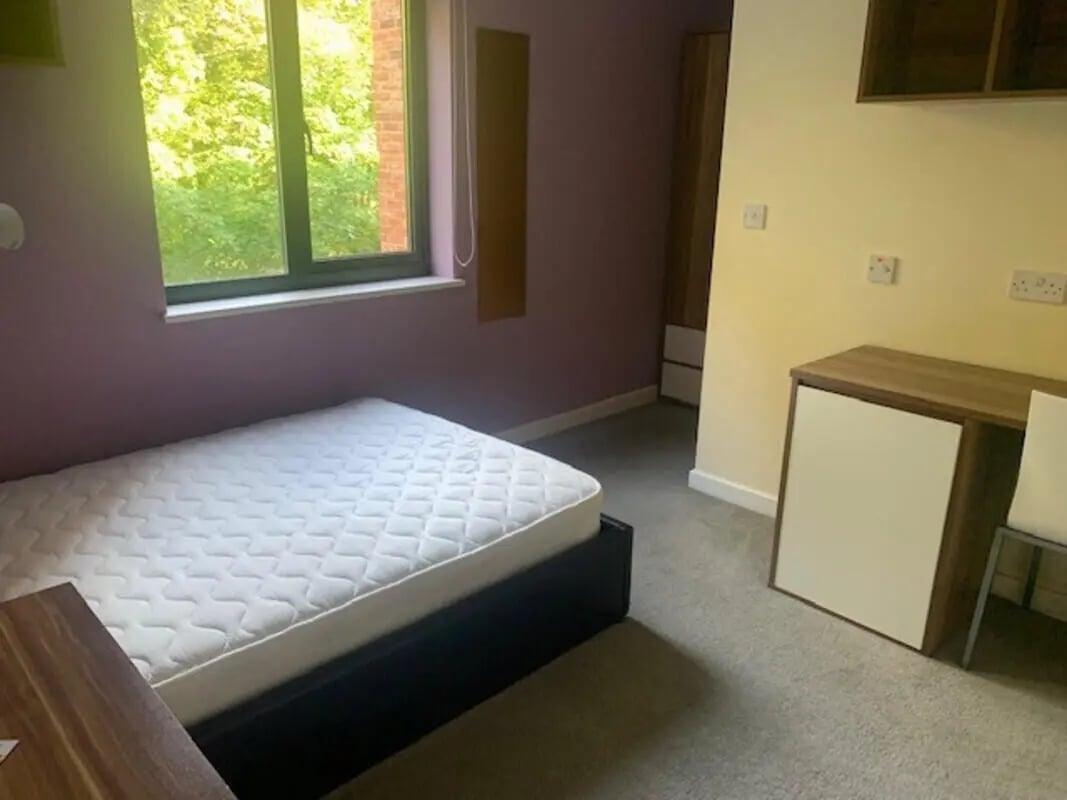 Bed wardrobe desk and chair bedroom at Canterbury Student Village in Canterbury Student Accommodation