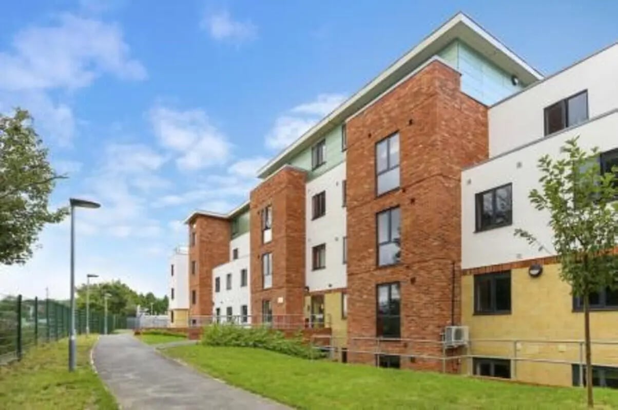 Brick and white building windows exterior at Canterbury Student Village in Canterbury Student Accommodation