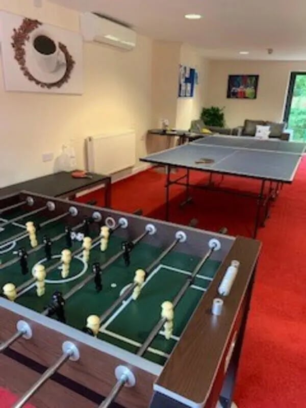 Foosball table ping pong table seating area lounge at Canterbury Student Village in Canterbury Student Accommodation